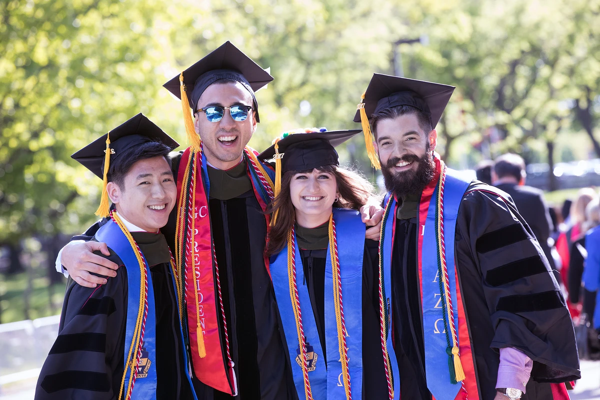 Graduating students with regalia 